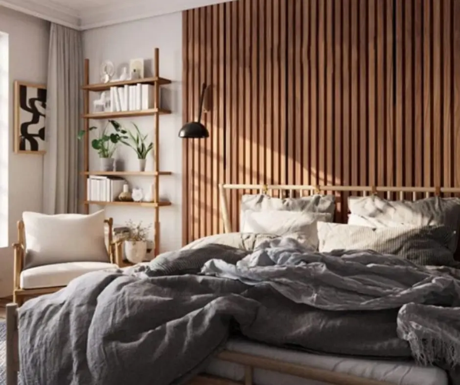 Wood slat accent wall behind bed in modern neutral bedroom.