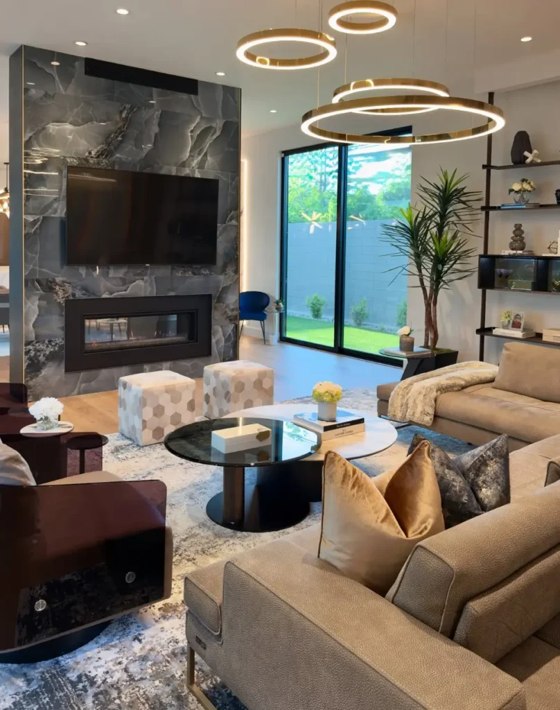 Luxurious marble fireplace wall with mounted TV and elegant décor.