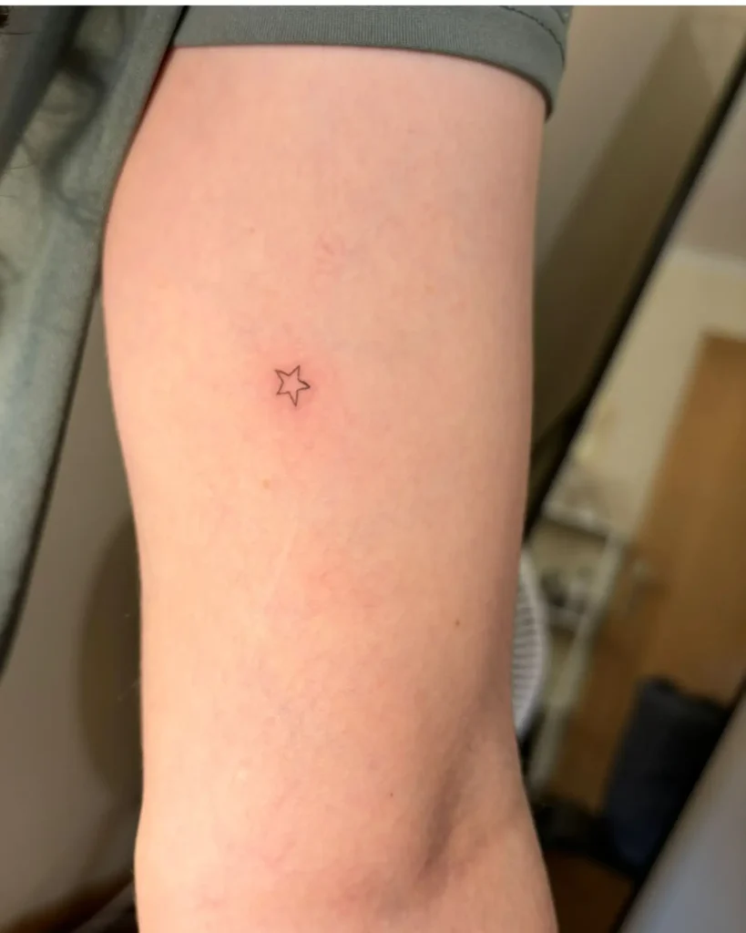 Tiny Star Fine Line Tattoo – Light, Hope, and Inner Guidance
